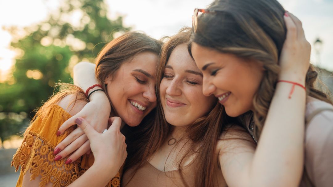 Friends embracing warmly